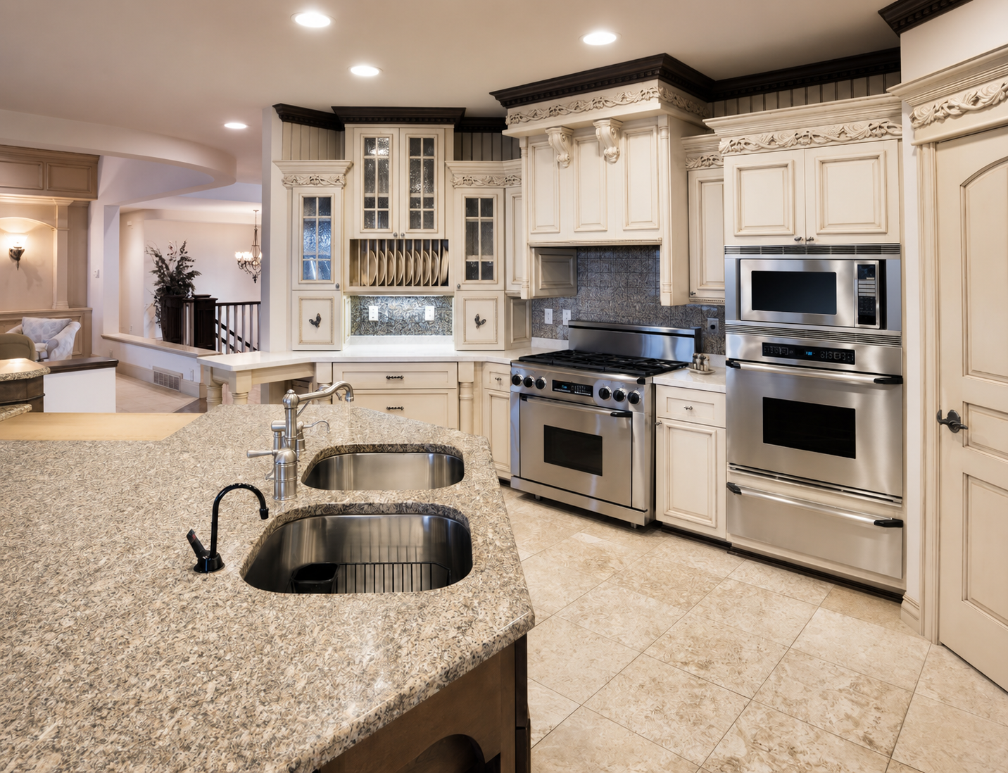 Traditional cream kitchen with carved crown molding, corbels, glass-front cabinets, and granite countertops
